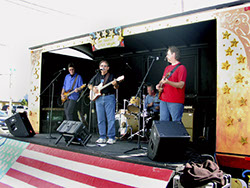 Image of Bob Christensen, Mark Dodge, Roger Ludwick, and Kevin Miller at the Stanwood-Camano Music Festival show, Sept. 7, 2002