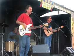 Image of Bob Christensen, Mark Dodge, and Kevin Miller at the Stanwood-Camano Music Festival show, Sept. 7, 2002